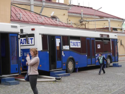 Toilet bus.  Pay, collect paper, sit with doors across aisle, leave by rear!