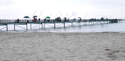 The beach at Lido di Voltano ... a row of fishermen and the Adriatic around here is dead flat. The Lido is a rather shabby resort, not helped by the grey weather, but still a hot spot for the Italians ... there were about 20 motorhomes all parked up.