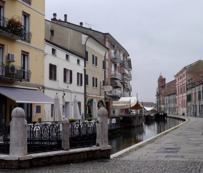 Restaurants extended over the water.