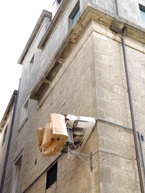 Health and Safety: we watched as this rubbish was thrown down into the street. There was a spotter at ground level, but the rubbish landed and remained nicely balanced on the wall mounted lamp ... for now!