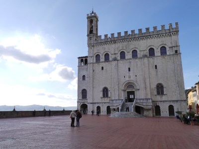 The Plazzo dei Consuls with the Piazza Grande supported by massive arches.