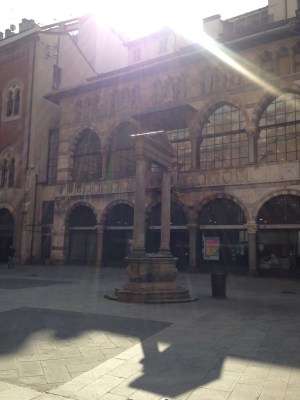 The old market place. It had a fun corner, well two corners, where you could whisper to each other. If a merchant could not repay his debts, his assets were seized and then his trading desk was publicly smashed ... broken bench = banca rotta. This word has been adopted in many languages.