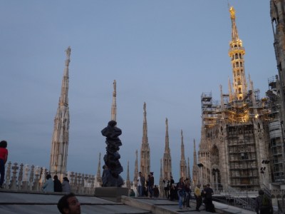 Some odd modern sculptures right up top! The Duomo has been described as 'Dripping Up' .. so many spires. Something like 3,600 statues!