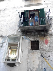 Ex voto shrine, washing and grafitti ... this is Naples.