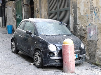 Abandoned car.  Despite our tour guide saying that there are few accidents given the crazy driving and parking we saw a number of scrapped and dented cars.  Great place to learn to drive!?