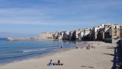 Beach and the old fishermen houses hugging the waterfront.