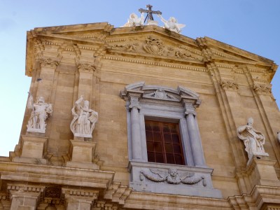 Duomo: Thomas a becket on the left of the window. But what made me chuckle was the naughty cherubs who are playing on the roof!